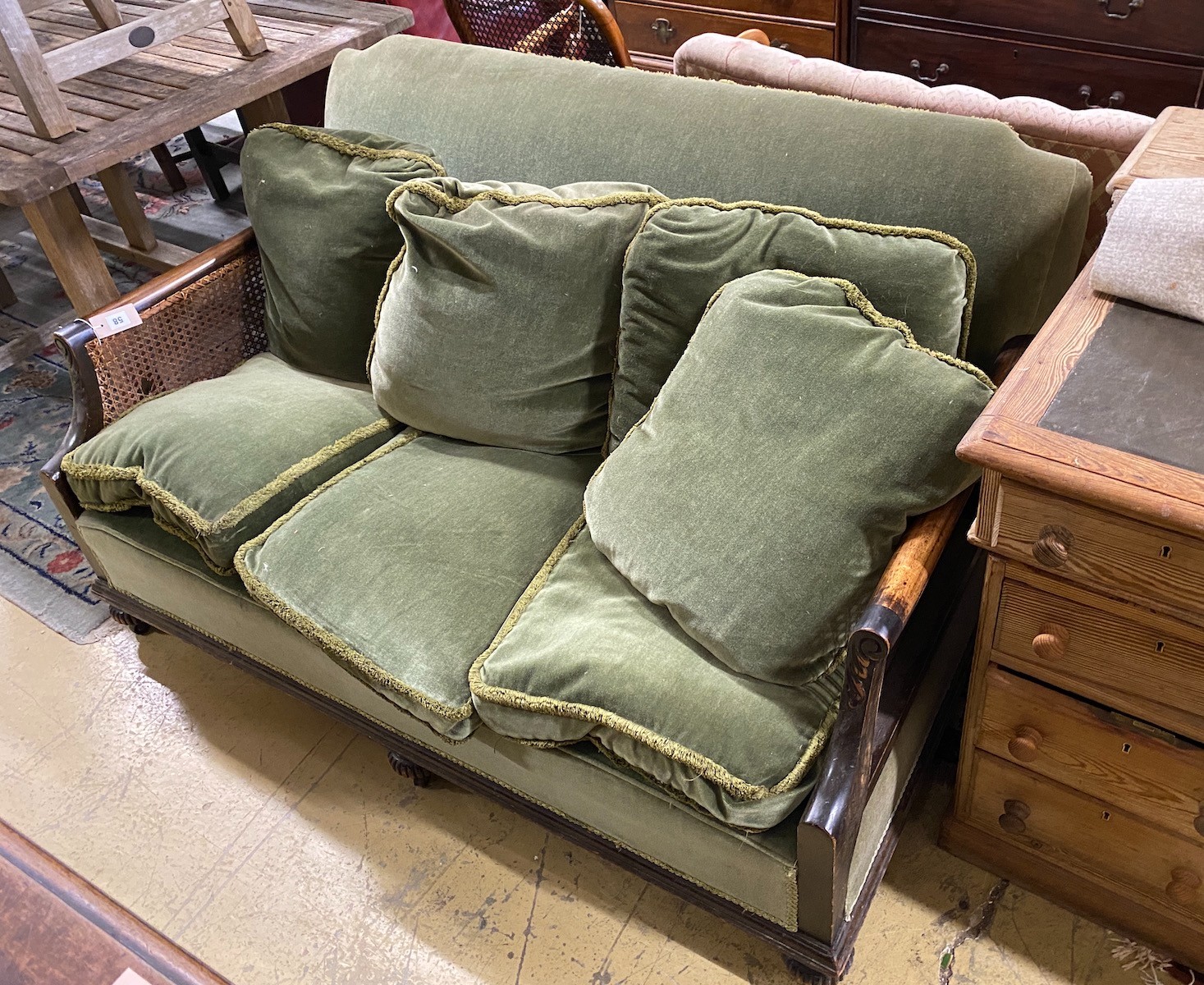 An early 20th century mahogany bergere settee, length 142cm, depth 88cm, height 82cm